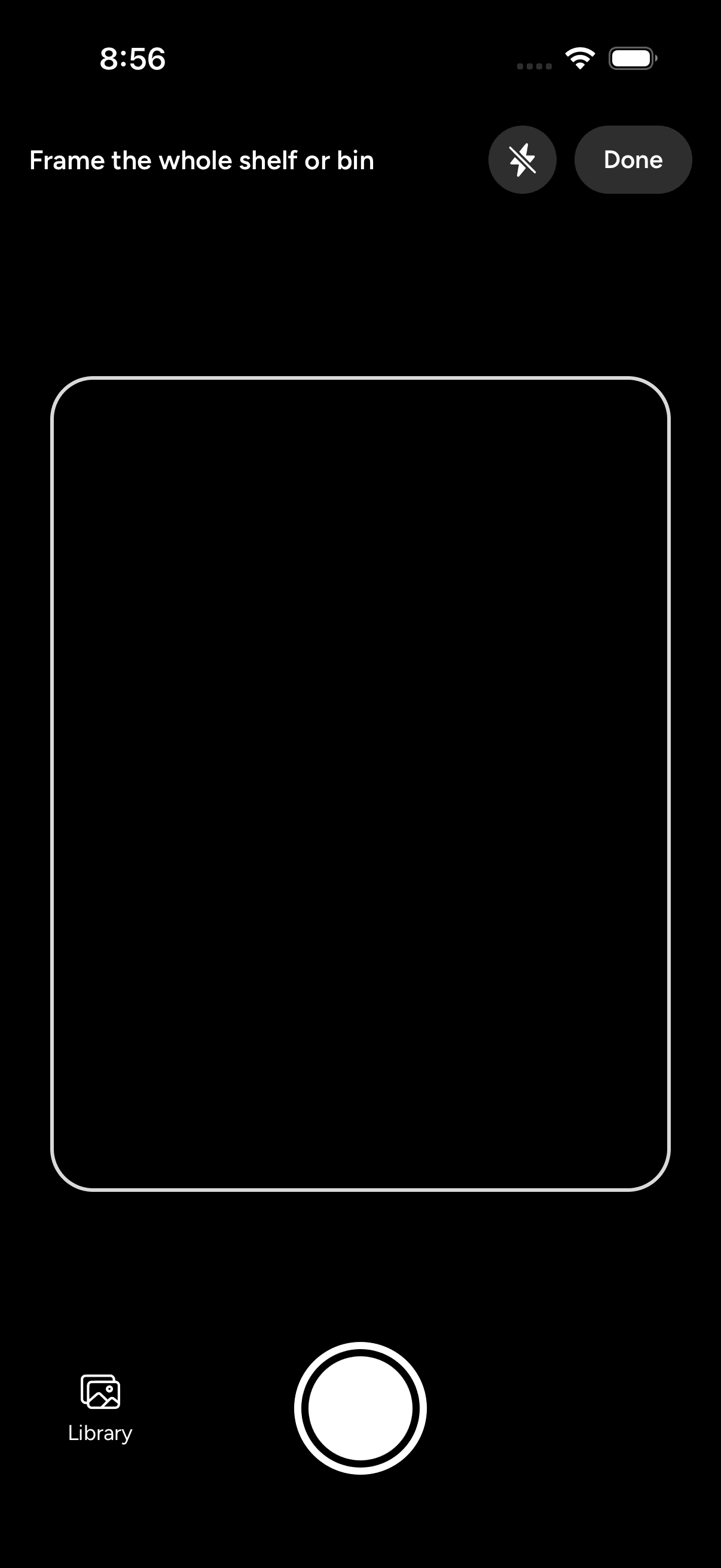 The mobile photo import camera with a framing guide, shutter button, and Library button