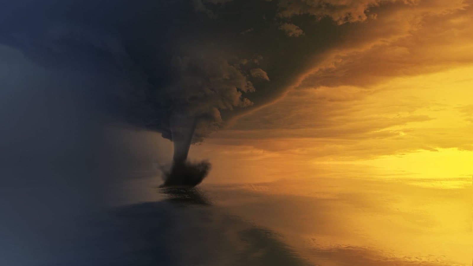 A tornado funnel over open water at sunset, backlit in gold and slate blue